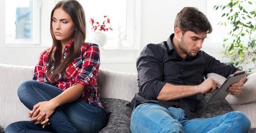 young couple in conflict, male with a tablet in hands; Shutterstock ID 137684498; PO: aol; Job: production; Client: drone