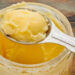 jar and measuring tablespoon of ghee - clarified butter