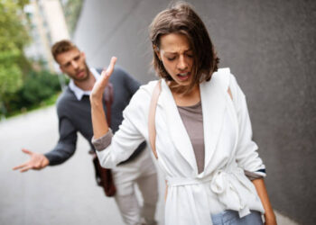 Breakup of a couple with man and sad girlfriend outdoor. Divorce, couple, love, pain concept.