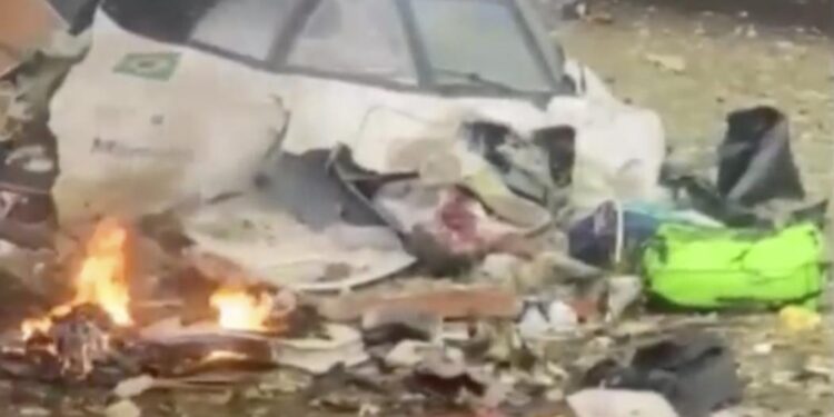 This frame grab from UGC video provided by Felipe Magalhaes Filho shows wreckage from a plane that crashed by a home in Vinhedo, Sao Paulo state, Brazil, Friday, Aug. 9, 2024. (Felipe Magalhaes Filho via AP)